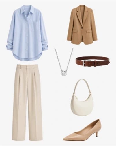 Light-blue shirt with a camel blazer, beige pants, cream bag, brown belt, necklace, and pointed heels.